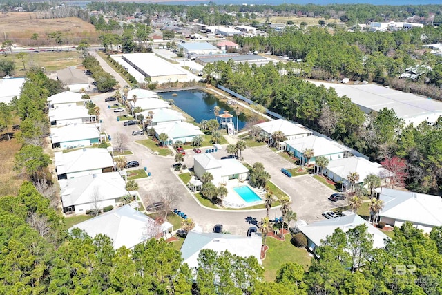 bird's eye view featuring a water view and a residential view