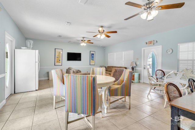 dining room with light tile patterned flooring and visible vents