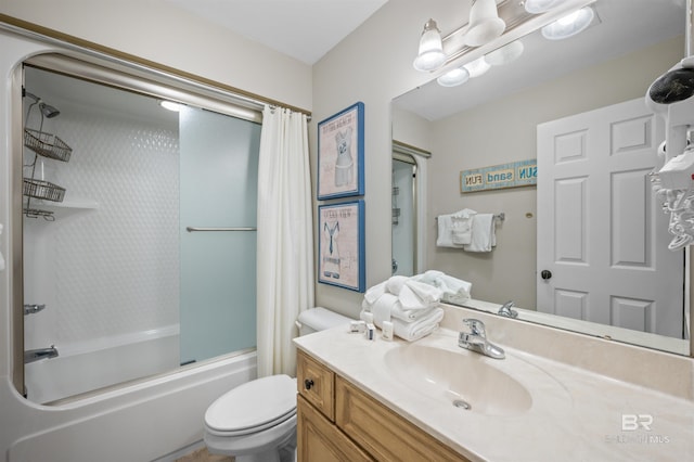 bathroom featuring vanity, shower / bath combo with shower curtain, and toilet