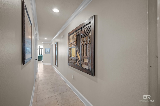 hall featuring ornamental molding, recessed lighting, baseboards, and light tile patterned floors