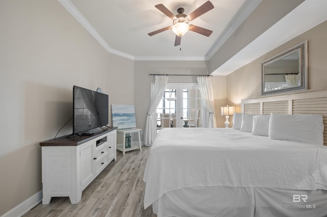 bedroom featuring baseboards, a ceiling fan, light wood-style flooring, ornamental molding, and french doors