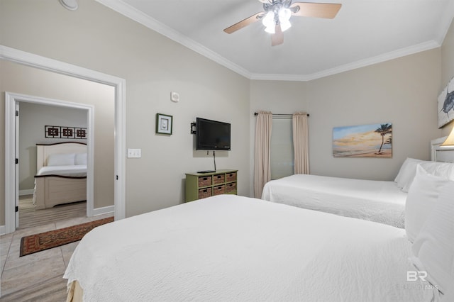 bedroom with ceiling fan, baseboards, crown molding, and ensuite bathroom