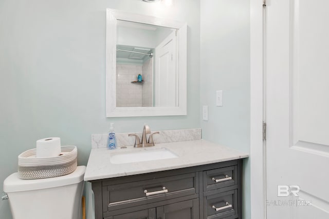 full bathroom featuring toilet and vanity
