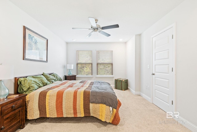 bedroom with light carpet and ceiling fan