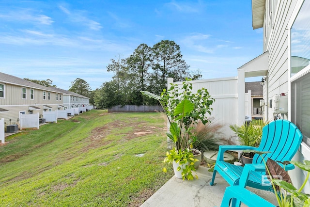 view of yard featuring a patio and central AC