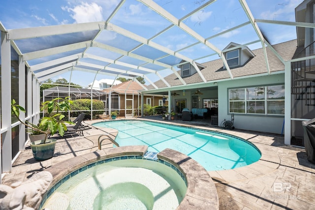 8585 Bay Harbor Rd, Elberta, AL 36530 - view of swimming pool featuring ceiling fan, a patio, a pool with connected hot tub, and a lanai