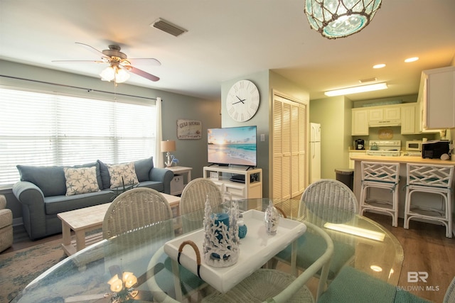 1477 W Lagoon Ave Unit 104, Gulf Shores, AL 36542 - dining space featuring dark wood-style floors, ceiling fan, visible vents, and recessed lighting