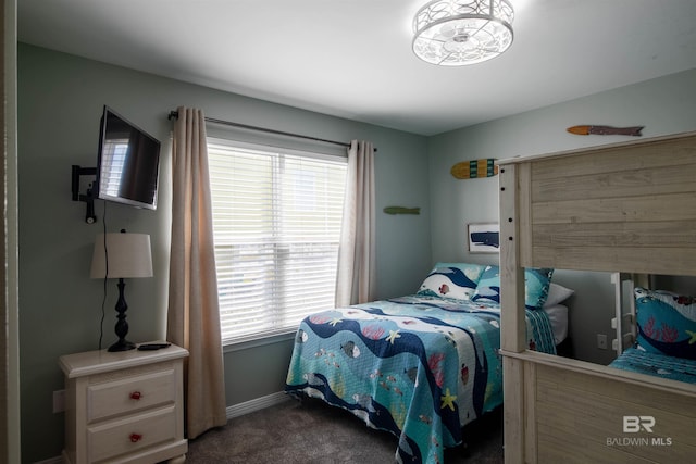 bedroom featuring carpet floors and baseboards