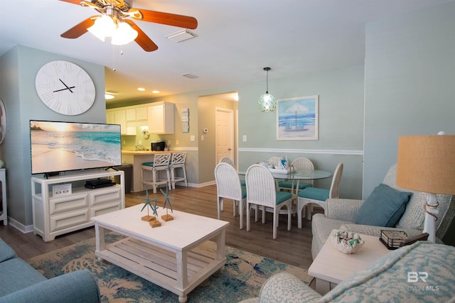 1477 W Lagoon Ave Unit 104, Gulf Shores, AL 36542 - living room featuring a ceiling fan, visible vents, wood finished floors, and recessed lighting