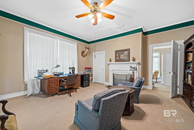 office space featuring light carpet, a fireplace, and ceiling fan