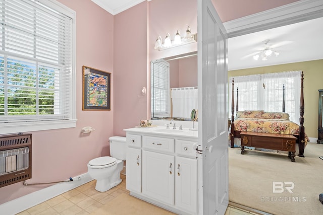 bathroom featuring vanity, ceiling fan, toilet, ornamental molding, and heating unit