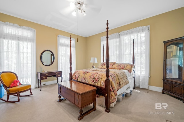 carpeted bedroom with multiple windows and ceiling fan