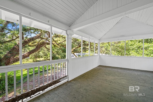 unfurnished sunroom with lofted ceiling and a wealth of natural light