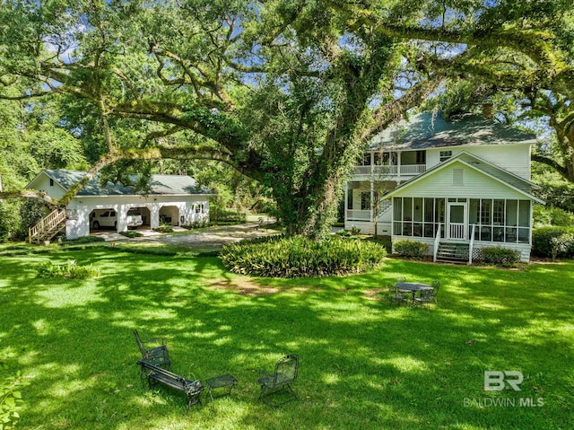 view of yard featuring a sunroom