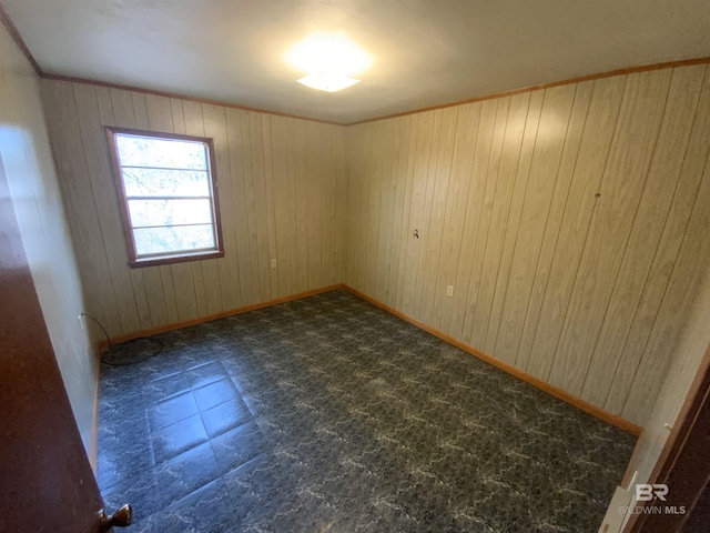 empty room with wood walls