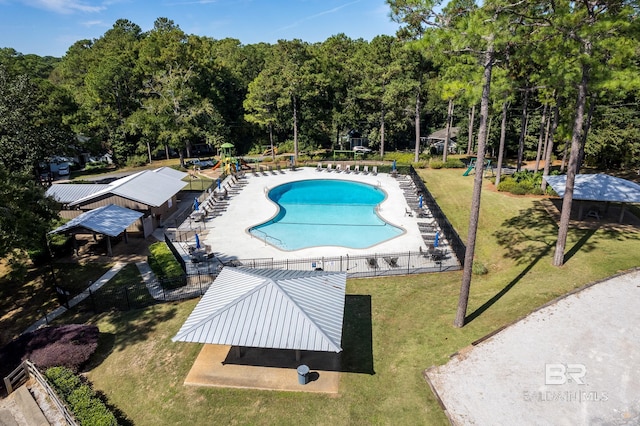 view of swimming pool featuring a gazebo and a lawn