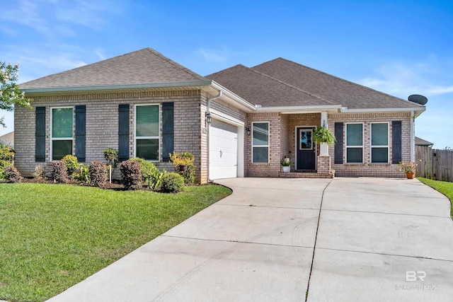 12786 Waxwing Ave, Spanish Fort, AL 36527 - view of front of house with concrete driveway, a garage, brick siding, and roof with shingles