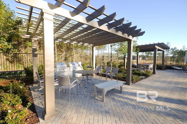 12786 Waxwing Ave, Spanish Fort, AL 36527 - view of patio / terrace with an outdoor kitchen, a pergola, and outdoor dining area