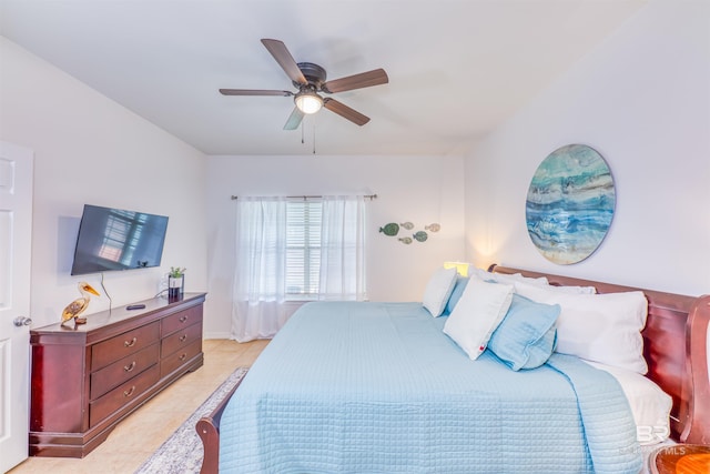 tiled bedroom with ceiling fan