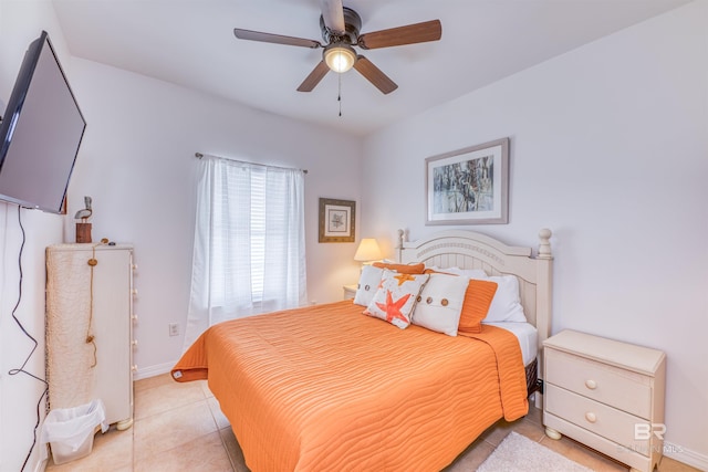 tiled bedroom featuring ceiling fan