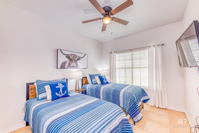 tiled bedroom with ceiling fan