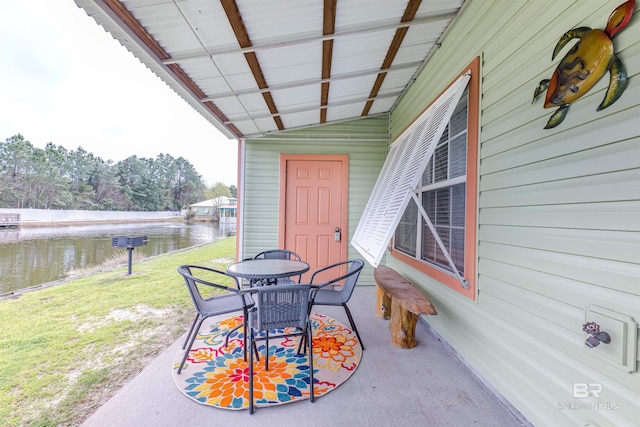 view of patio featuring a water view