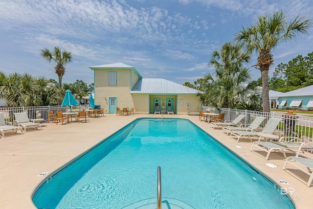 view of swimming pool featuring a patio