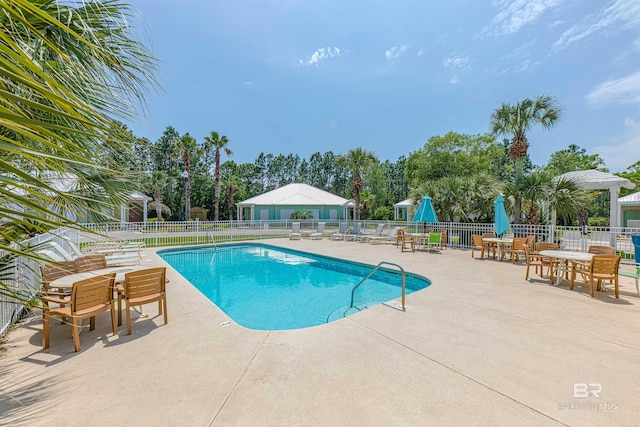 view of swimming pool featuring a patio area