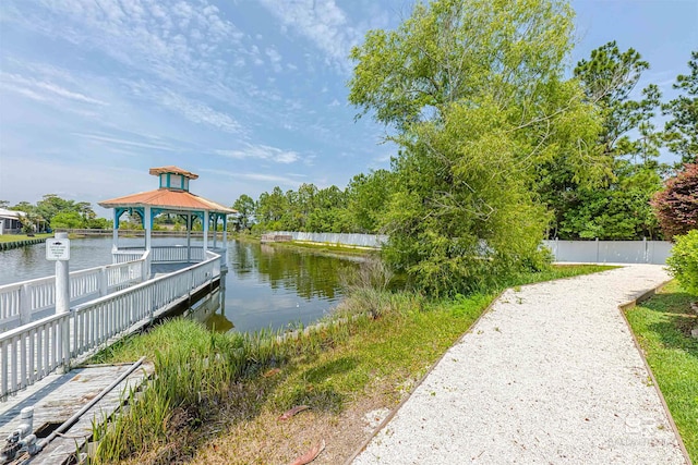 view of dock featuring a water view and a gazebo