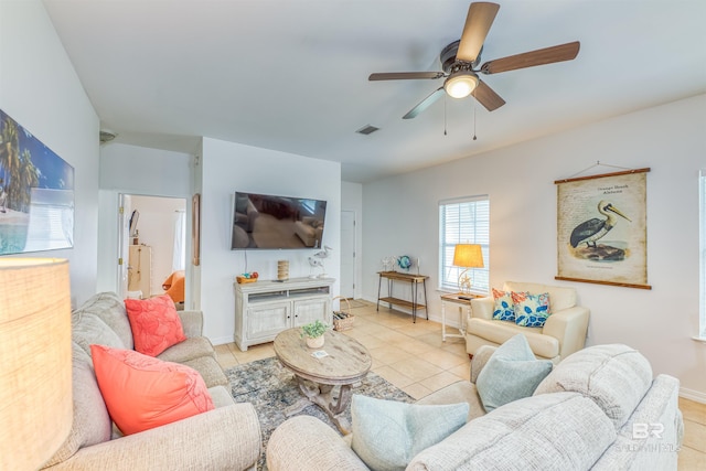 tiled living room with ceiling fan