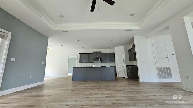1897 Carly St, Foley, AL 36535 - kitchen with open floor plan, a raised ceiling, a ceiling fan, stainless steel microwave, and ornamental molding
