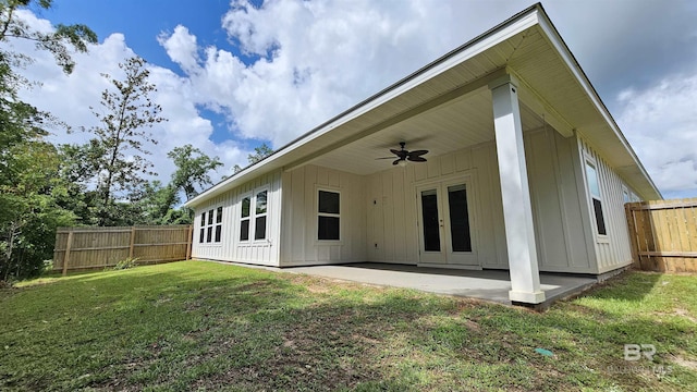 1897 Carly St, Foley, AL 36535 - back of property featuring board and batten siding, ceiling fan, french doors, and a patio