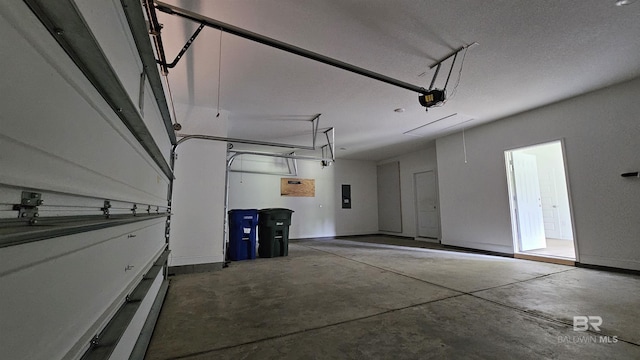 1897 Carly St, Foley, AL 36535 - garage featuring a garage door opener, electric panel, and baseboards