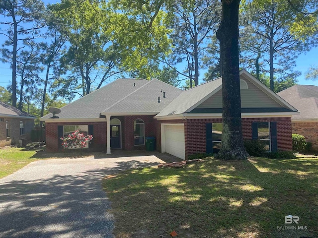 single story home with a garage and a front yard