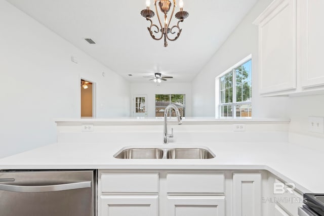 kitchen featuring stainless steel appliances, ceiling fan with notable chandelier, white cabinetry, and sink