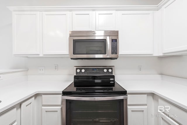 kitchen featuring white cabinets and stainless steel appliances