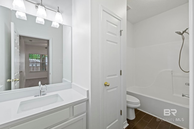 full bathroom featuring a textured ceiling, vanity, bathing tub / shower combination, and toilet