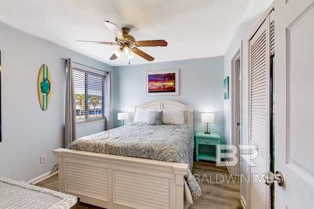 bedroom featuring baseboards, a ceiling fan, and wood finished floors