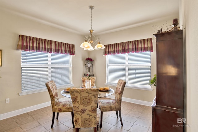 7091 Rocky Road Loop, Gulf Shores, AL 36542 - dining area featuring an inviting chandelier, baseboards, and light tile patterned flooring