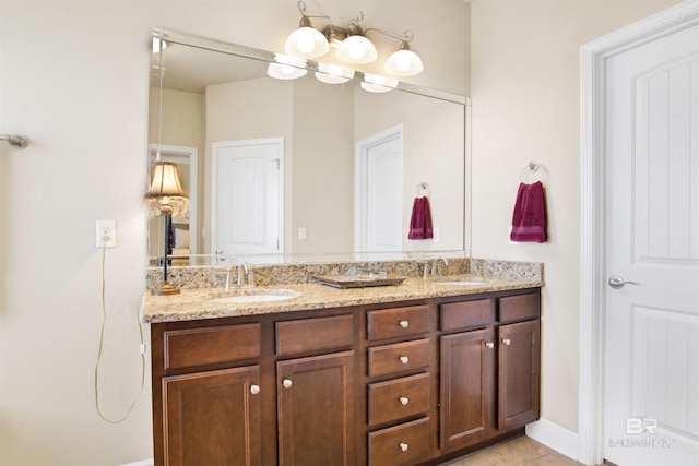 7091 Rocky Road Loop, Gulf Shores, AL 36542 - bathroom featuring a sink, double vanity, and tile patterned floors