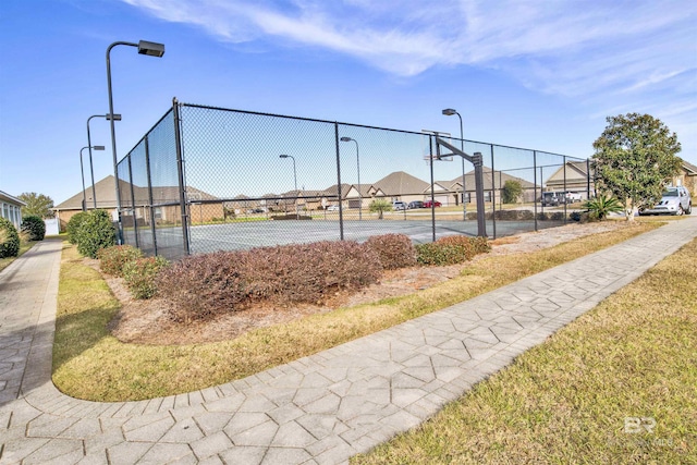 7091 Rocky Road Loop, Gulf Shores, AL 36542 - view of home's community featuring a tennis court, fence, community basketball court, and a residential view