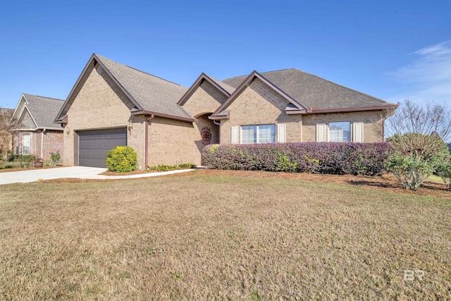 7091 Rocky Road Loop, Gulf Shores, AL 36542 - ranch-style home with roof with shingles, brick siding, concrete driveway, a garage, and a front lawn