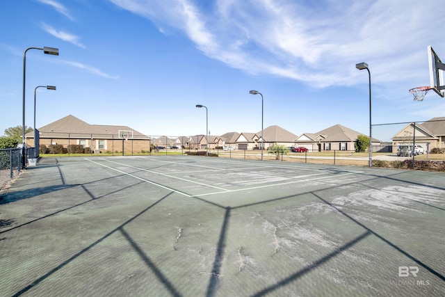 7091 Rocky Road Loop, Gulf Shores, AL 36542 - view of tennis court featuring a residential view and fence