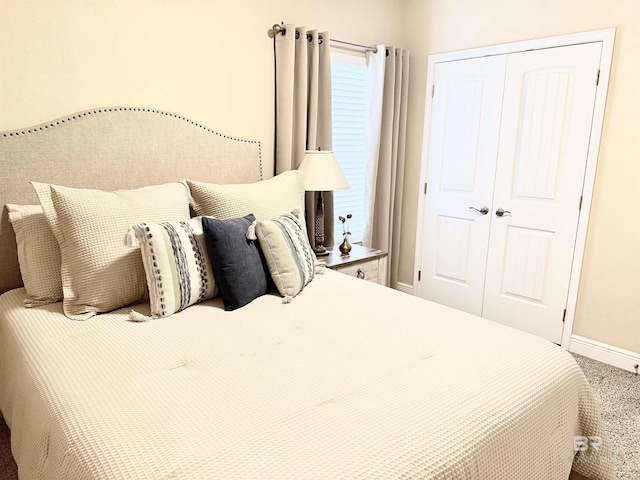7091 Rocky Road Loop, Gulf Shores, AL 36542 - carpeted bedroom with baseboards and a closet