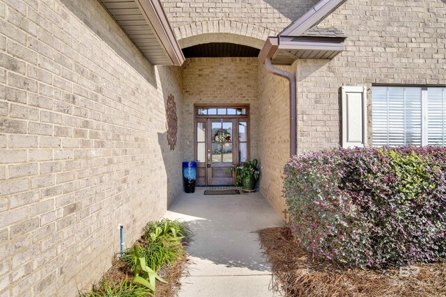 7091 Rocky Road Loop, Gulf Shores, AL 36542 - view of exterior entry with brick siding and french doors