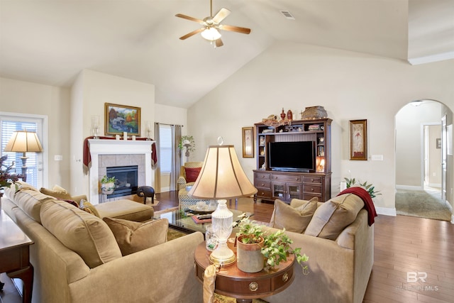 7091 Rocky Road Loop, Gulf Shores, AL 36542 - living area featuring a healthy amount of sunlight, hardwood / wood-style flooring, ceiling fan, and arched walkways