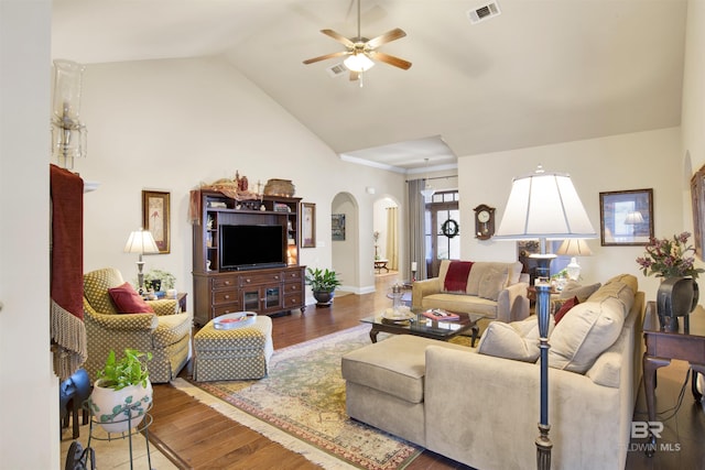 7091 Rocky Road Loop, Gulf Shores, AL 36542 - living room featuring wood finished floors, a ceiling fan, high vaulted ceiling, visible vents, and arched walkways
