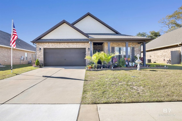 view of front of home featuring a garage and a front lawn