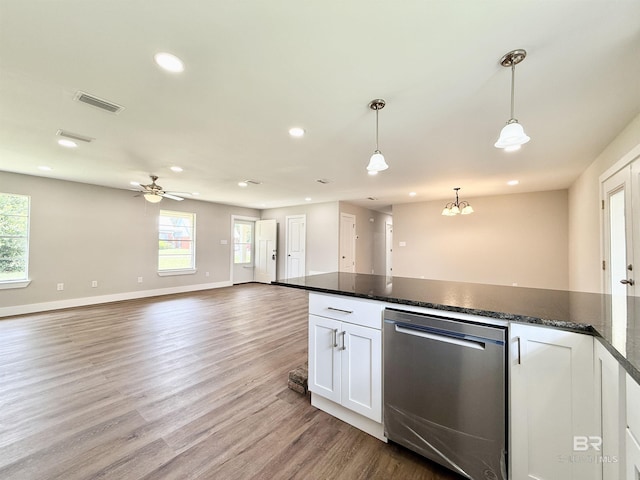 kitchen featuring a healthy amount of sunlight, recessed lighting, stainless steel dishwasher, and light wood finished floors