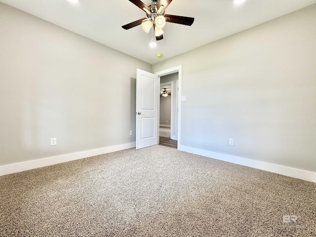 carpeted spare room featuring baseboards, recessed lighting, and a ceiling fan